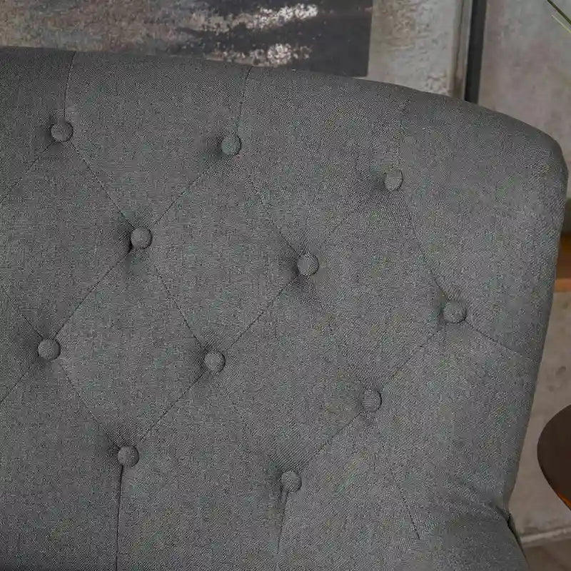 Fauteuil club en tissu capitonné avec dossier incurvé et pieds en bouleau