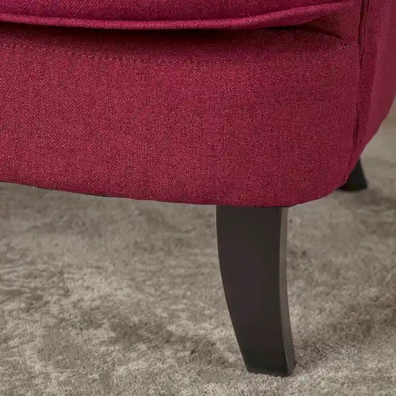 Fauteuil club en tissu capitonné avec dossier incurvé et pieds en bouleau