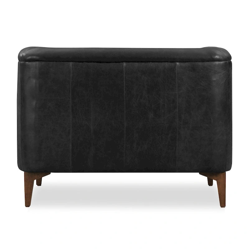 Fauteuil de salon capitonné en cuir italien avec pieds en bois massif et coussin en plumes