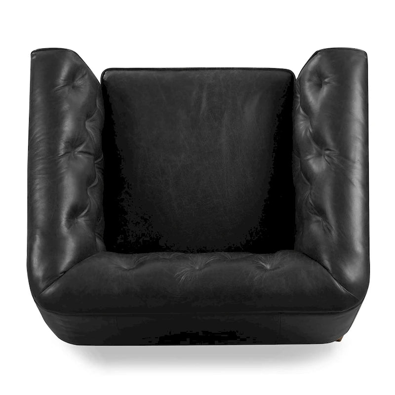 Fauteuil de salon capitonné en cuir italien avec pieds en bois massif et coussin en plumes