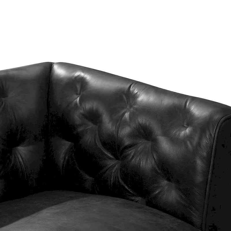 Fauteuil de salon capitonné en cuir italien avec pieds en bois massif et coussin en plumes